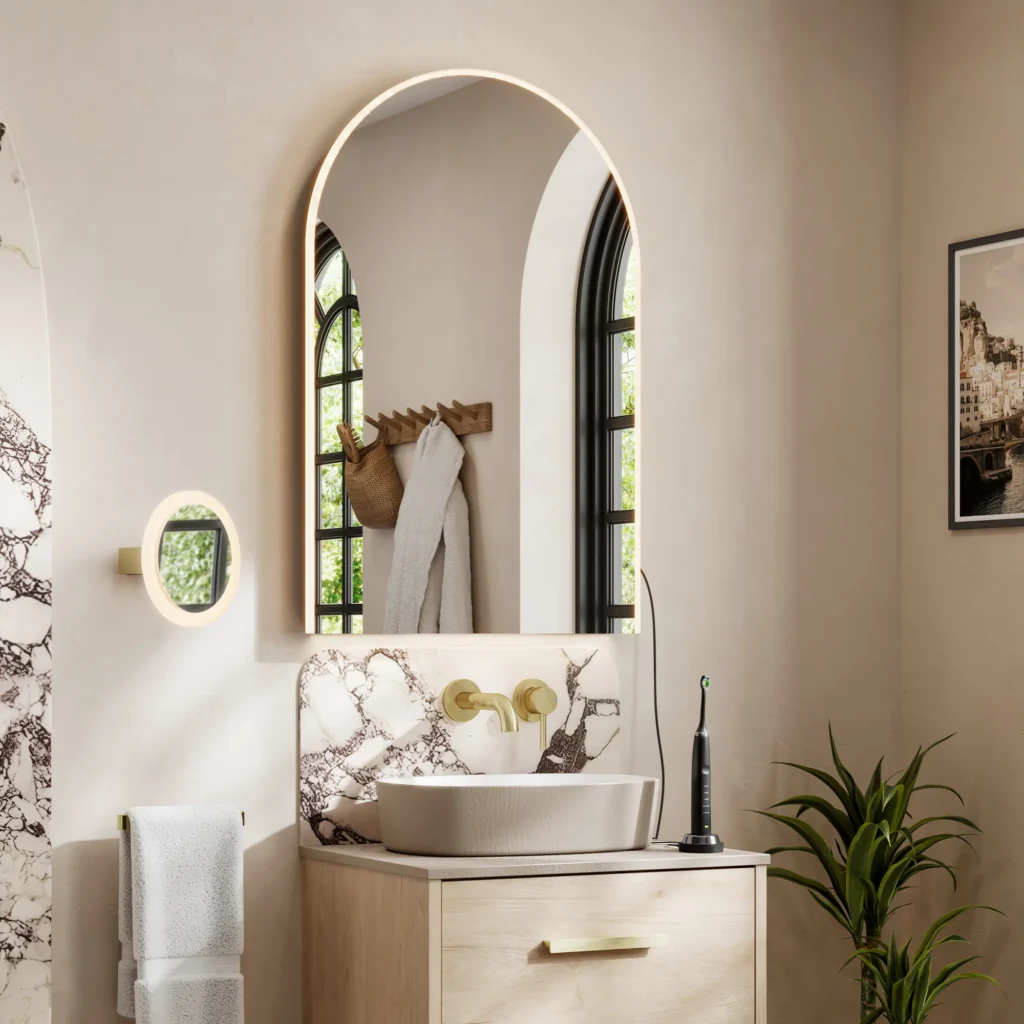 Arched LED bathroom mirror above a countertop basin