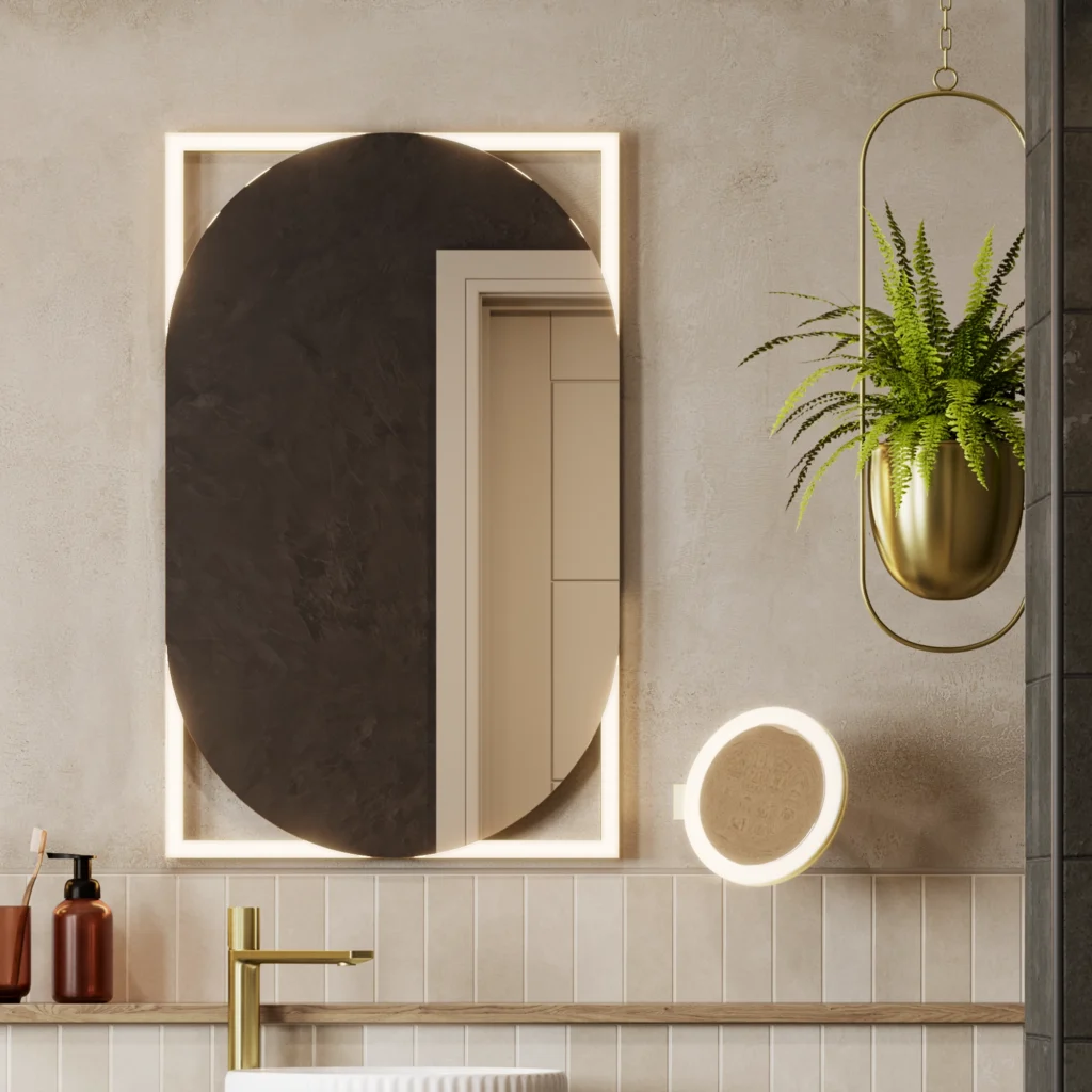 Oval backlit LED bathroom mirror on a tiled wall